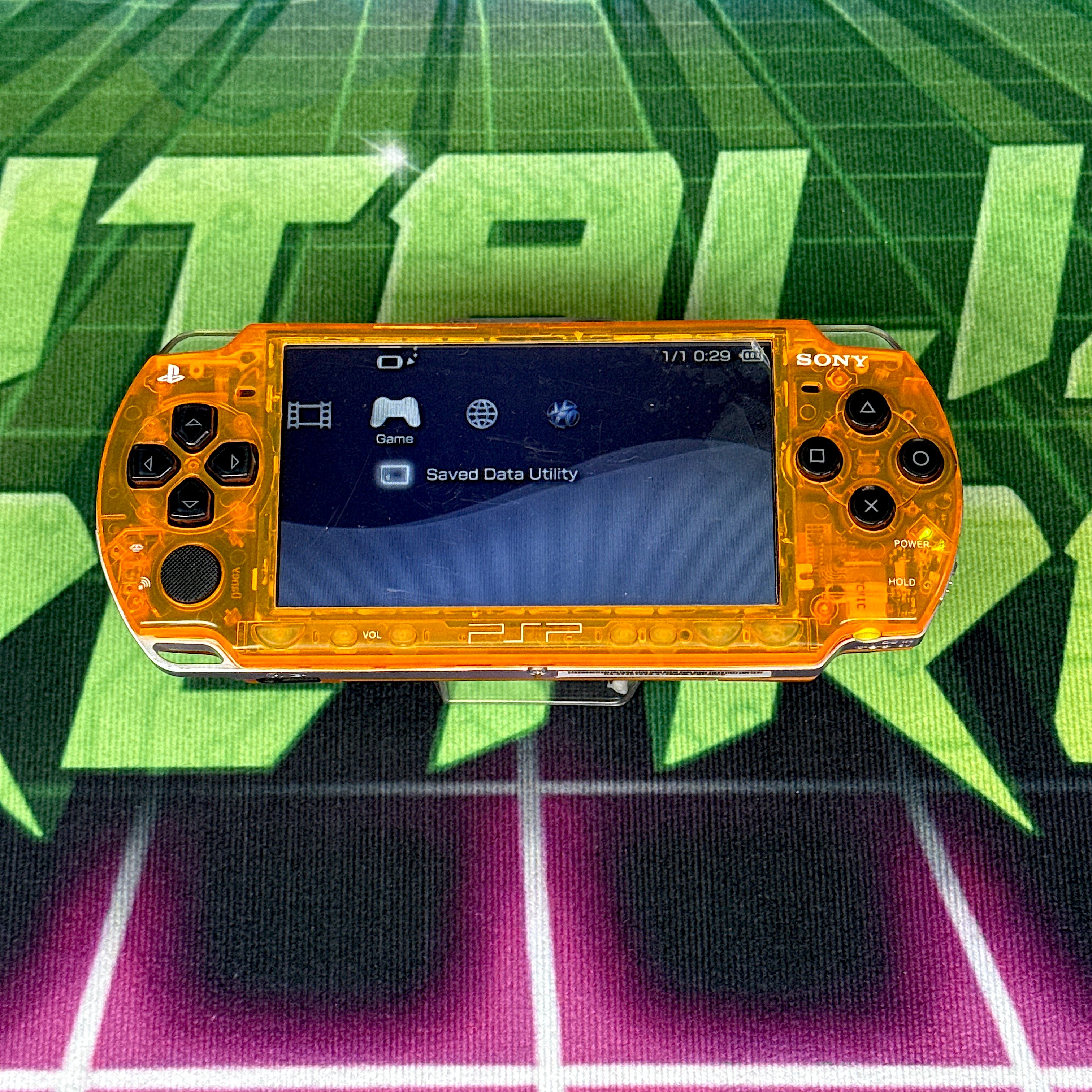 PSP 2000 Handheld Console – Clear Orange w/ Black Buttons (Refurbished)