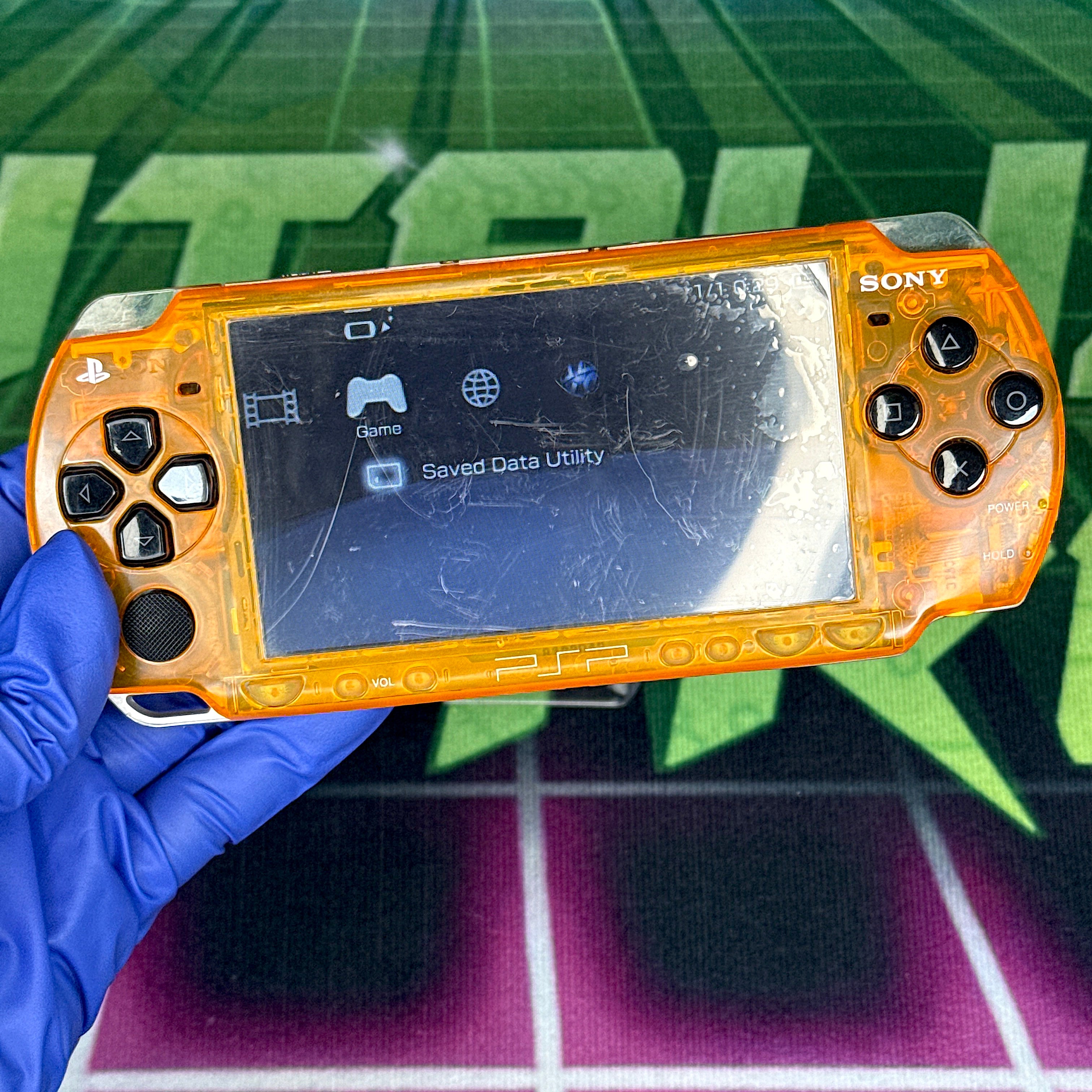 PSP 2000 Handheld Console – Clear Orange w/ Black Buttons (Refurbished)