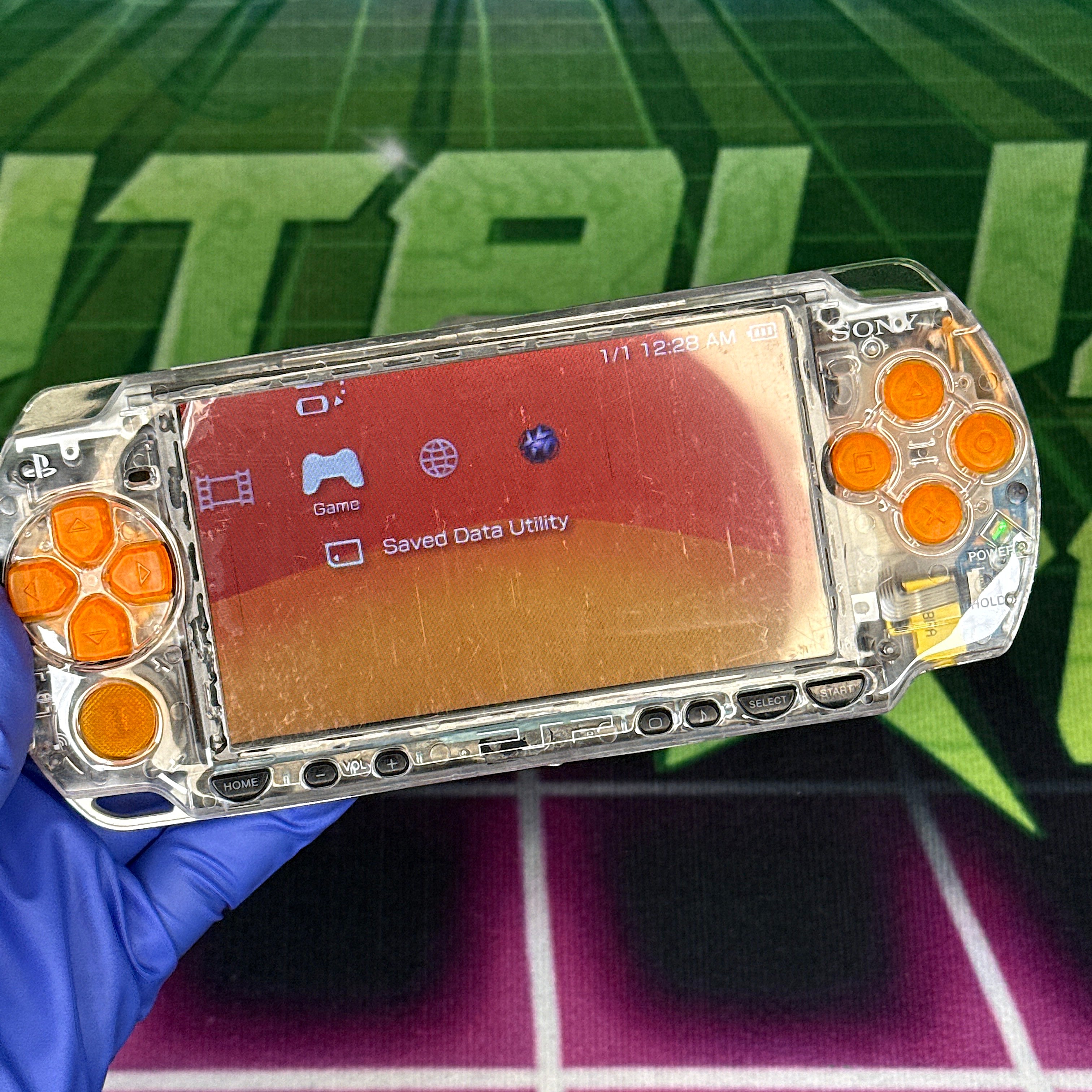 PSP 2000 Handheld Console – Clear w/ Orange Buttons (Refurbished)