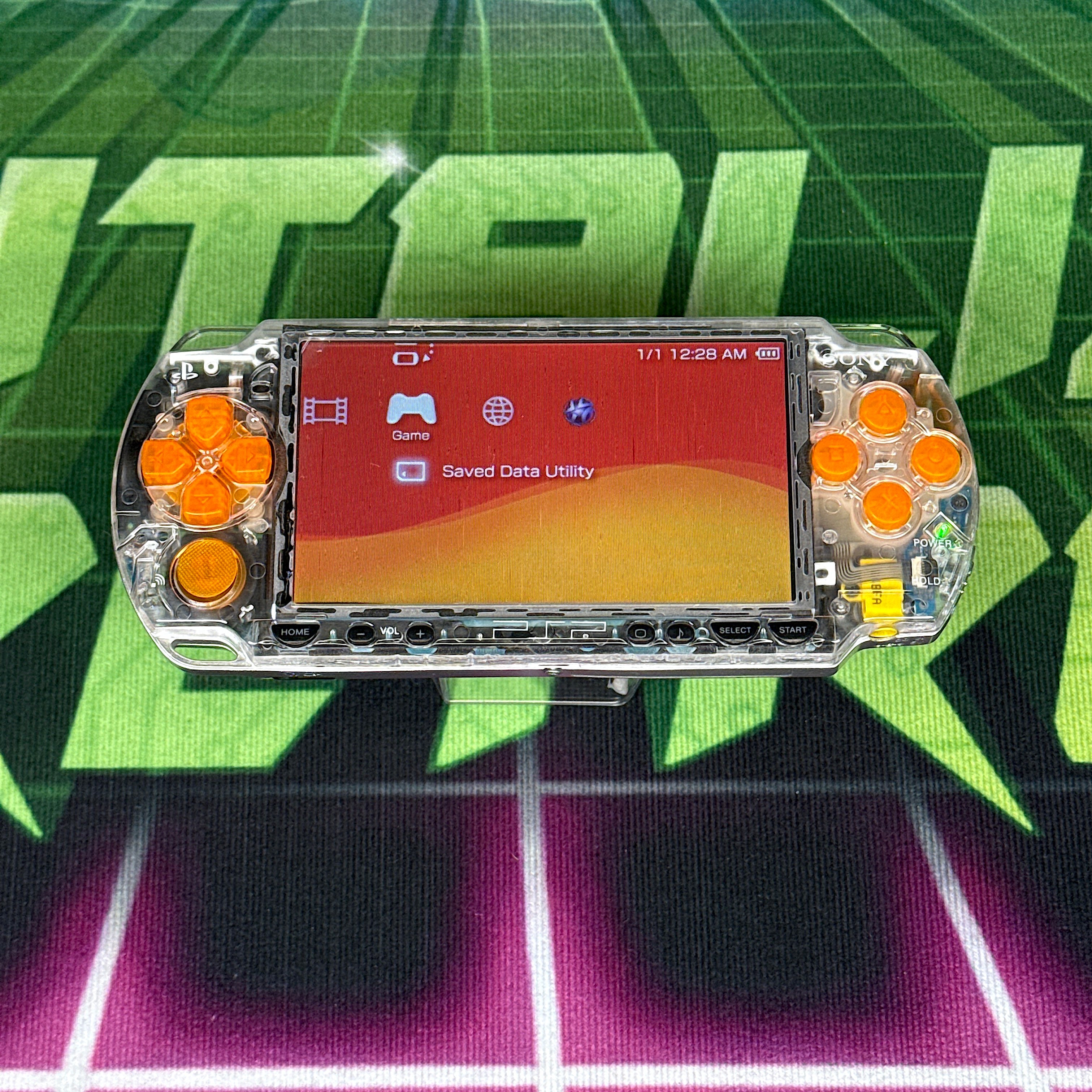 PSP 2000 Handheld Console – Clear w/ Orange Buttons (Refurbished)